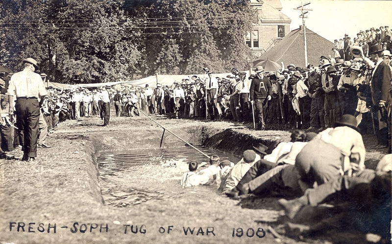 Large crowd around tug of war. 