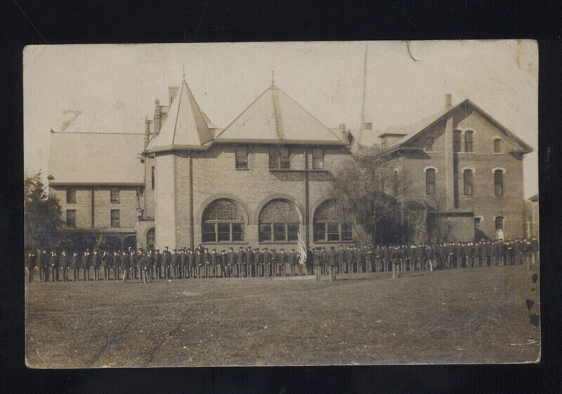 Line of people standing in front of Margaret Hall