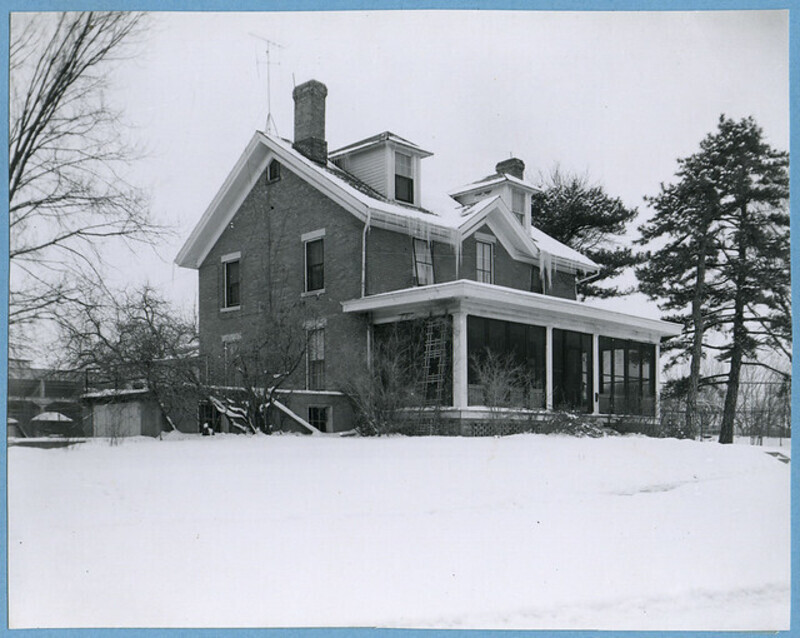 View of the side angle of Marston Cottage in the winter of 1956.