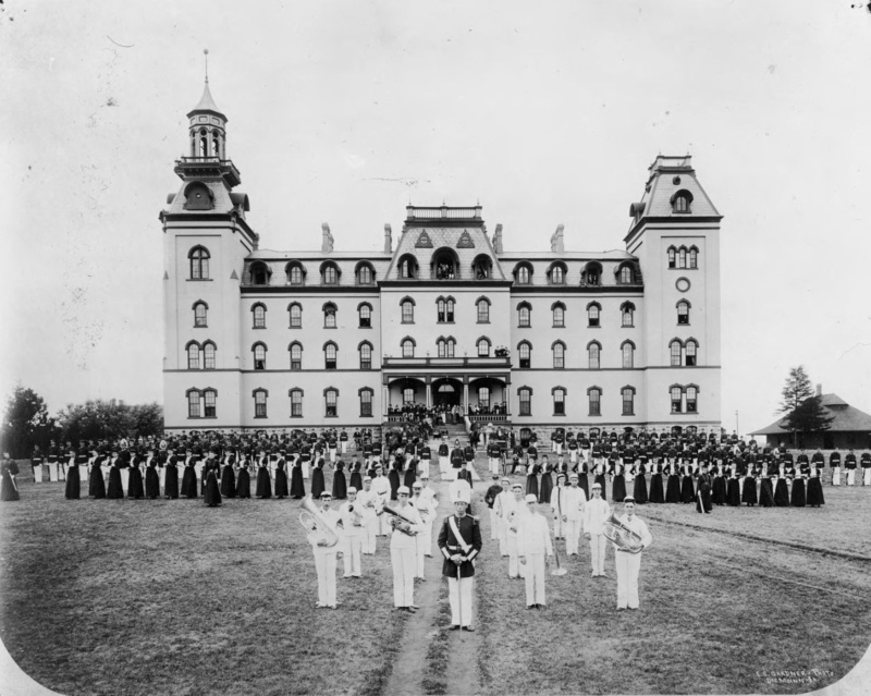 Marching band assembeled in front of Old Main 