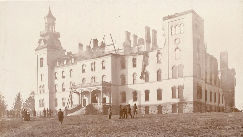 Bystanders watching the smoke from Old Main and observing the damage 