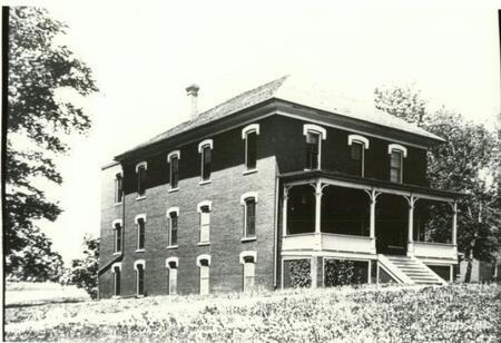 Side view of Boarding Cottage West and front porch