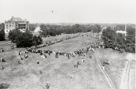 Botany Hall, Excursion Day 1898 Crowds gathered in a circle on the lawn south of Botany Hall which stands in the distance.