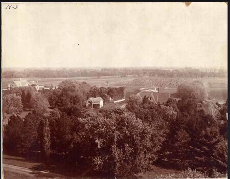 Farm Laborer's Cottage with neighboring houses, farm land, and trees. 