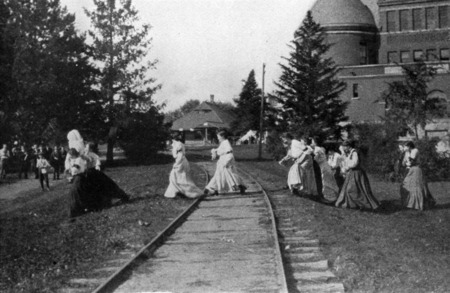 Women crossing across the traintracks. Hub and Morrill.