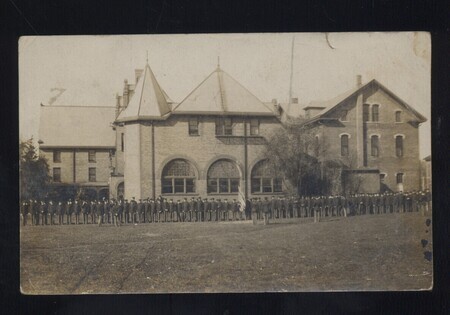 Line of people standing in front of Margaret Hall