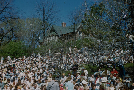 Students gathering on the side of the hill next to Music Hall