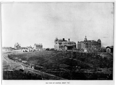 Wide street view of the The Old Chemistry Building, Maples, Presidents Residence, and Old Main circa 1876