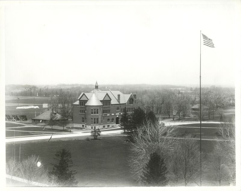 Morrill Hall is at the center of this campus view. The Hub is to the left and was used as a post office, bookstore, and depot station for the Ames and College Railway.